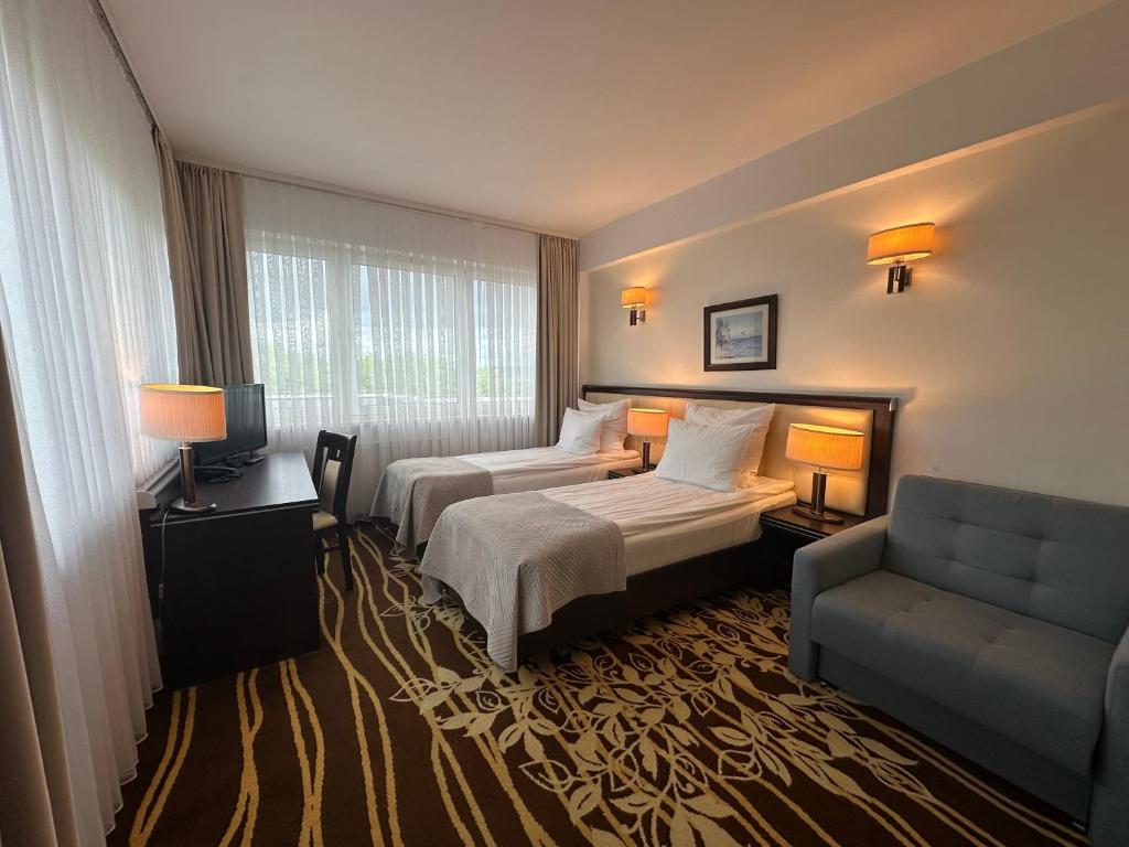 Postel nebo postele na pokoji v ubytování Hotel Business Faltom Gdynia