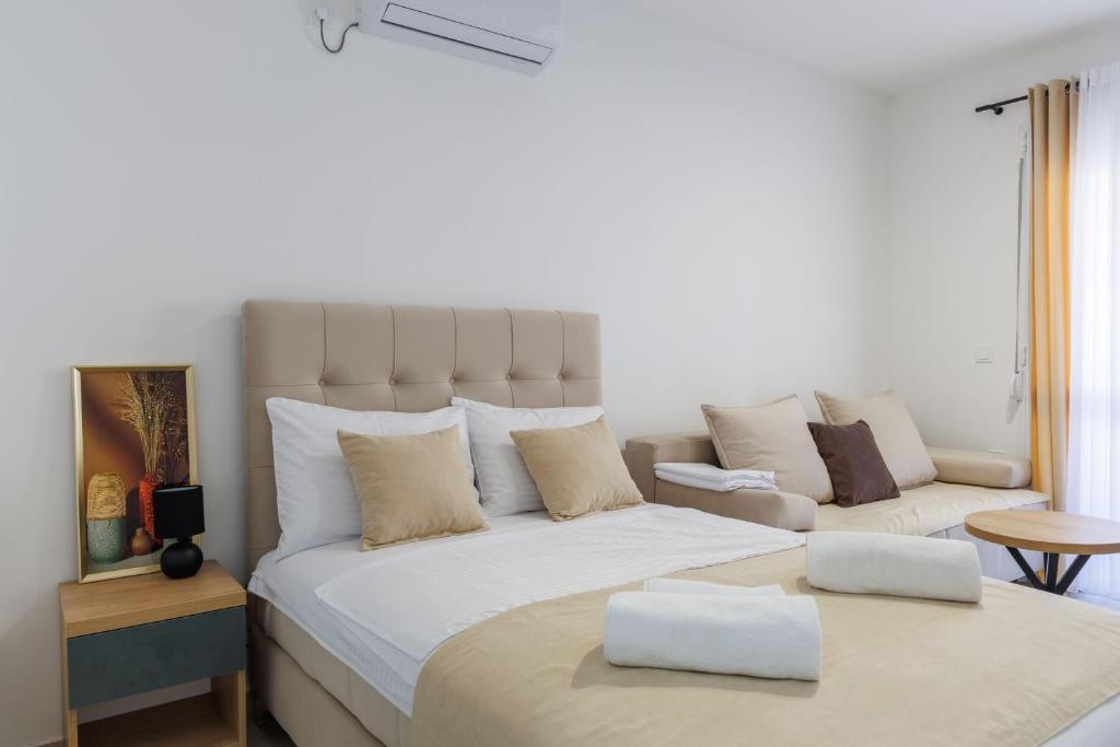 Postel nebo postele na pokoji v ubytování Apartments Donna