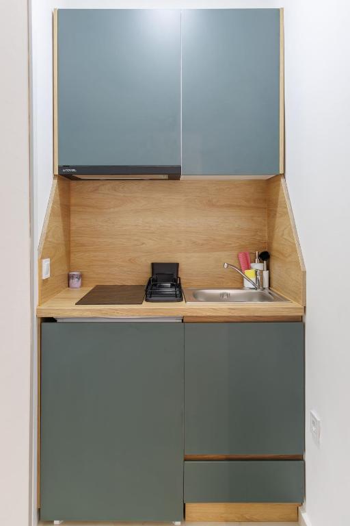 Kuchyň nebo kuchyňský kout v ubytování Apartments Donna