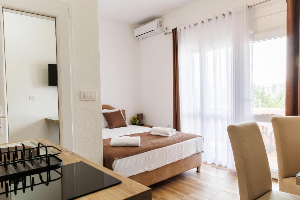 Postel nebo postele na pokoji v ubytování Apartments Donna