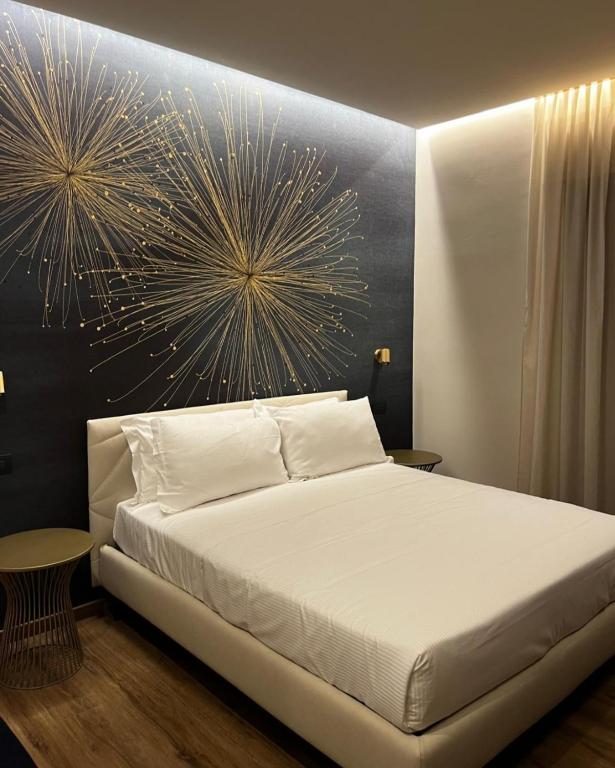Postel nebo postele na pokoji v ubytování Hotel La Rocca