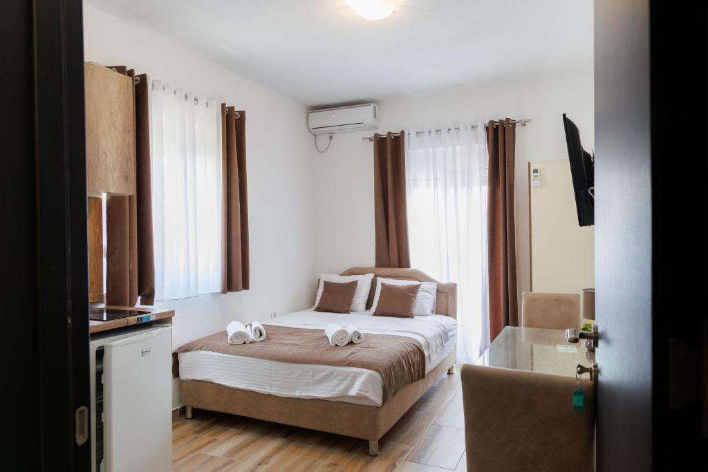 Postel nebo postele na pokoji v ubytování Apartments Donna