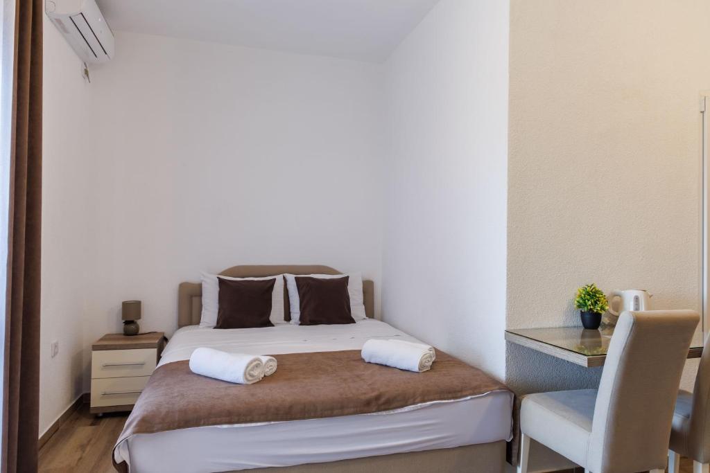 Postel nebo postele na pokoji v ubytování Apartments Donna
