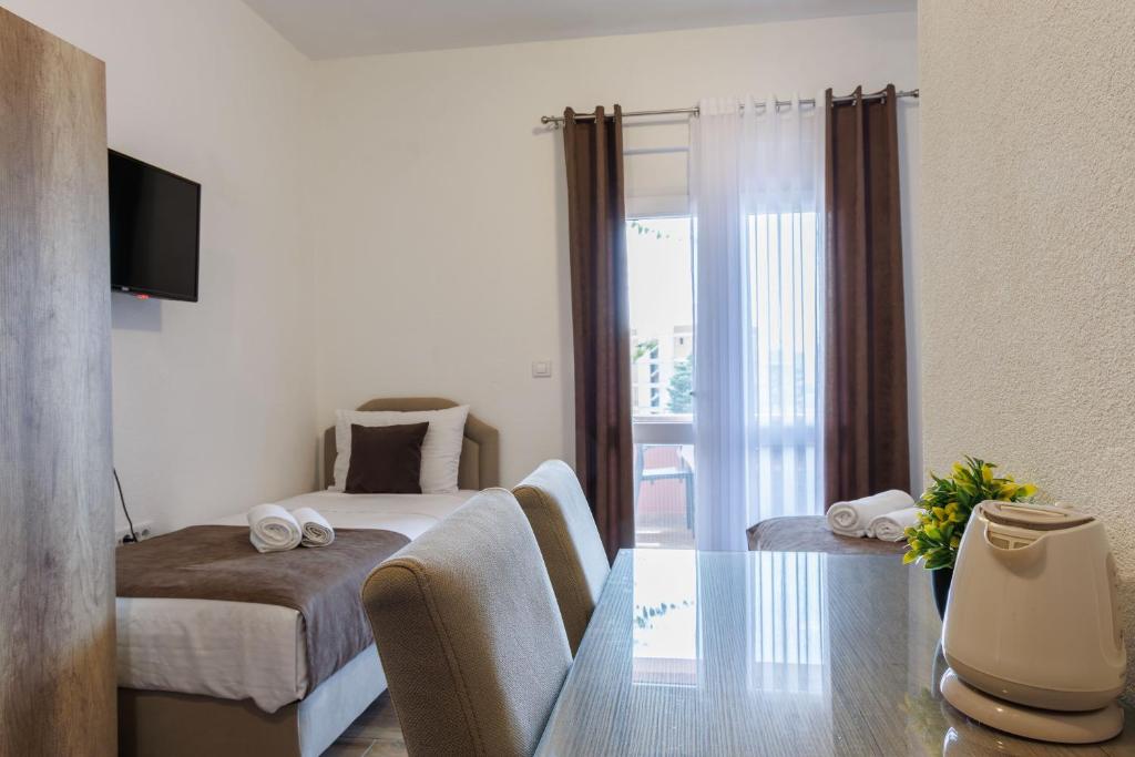 Postel nebo postele na pokoji v ubytování Apartments Donna