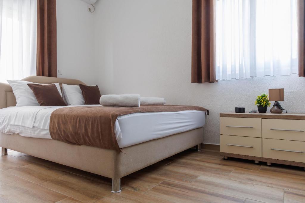 Postel nebo postele na pokoji v ubytování Apartments Donna
