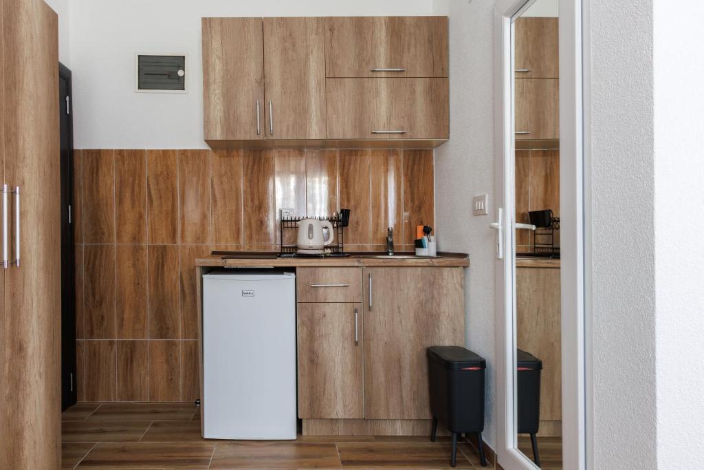 Kuchyň nebo kuchyňský kout v ubytování Apartments Donna