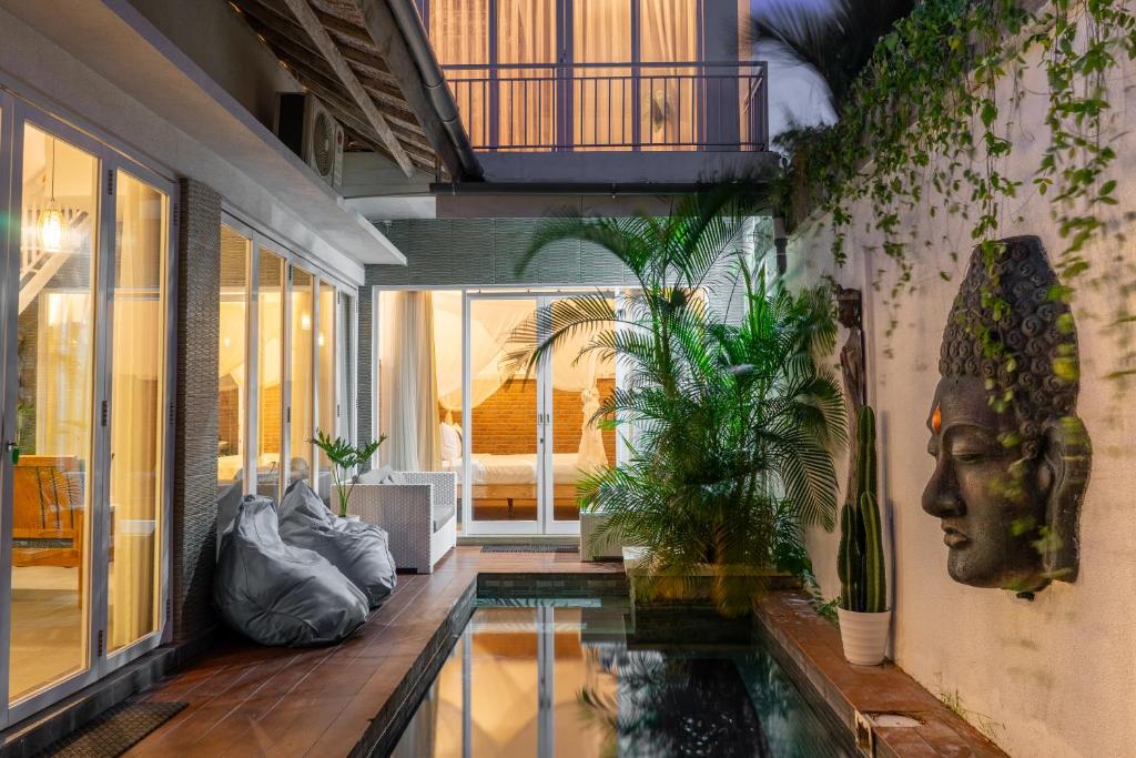 a house with a swimming pool in the middle of it at Private-Pool Family Villa near Canggu Beach in Tumbak Bayuh