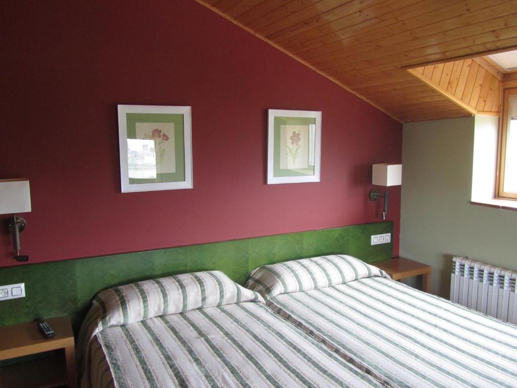 Postel nebo postele na pokoji v ubytování Hotel Galayos