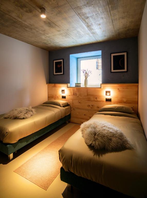 Postel nebo postele na pokoji v ubytování Locanda del Viandante by Heima