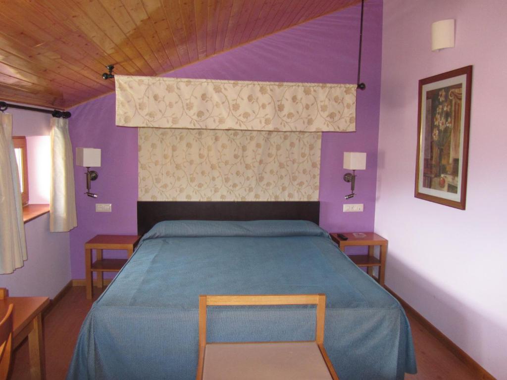 Postel nebo postele na pokoji v ubytování Hotel Galayos