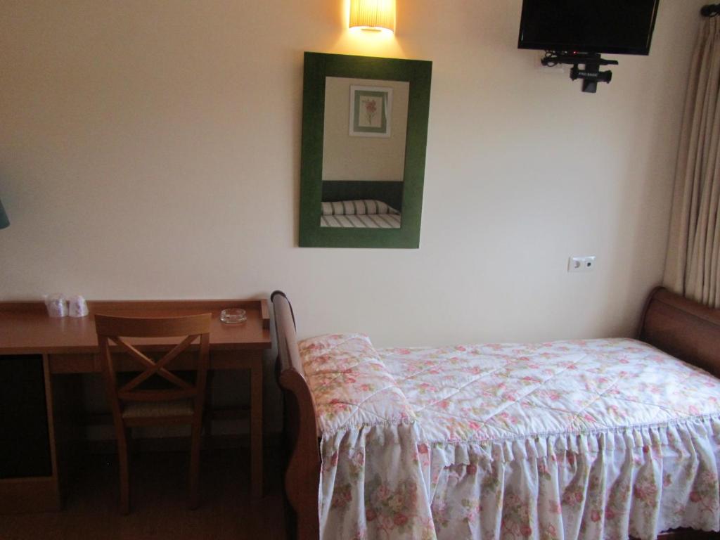Postel nebo postele na pokoji v ubytování Hotel Galayos