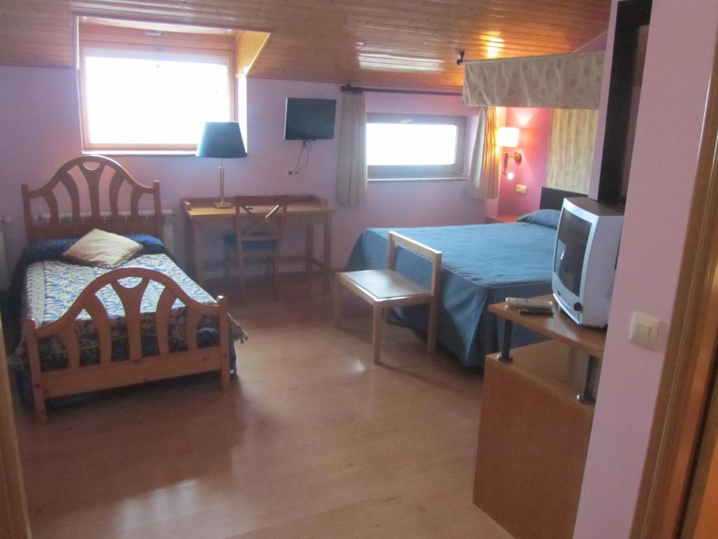 TV a/nebo společenská místnost v ubytování Hotel Galayos