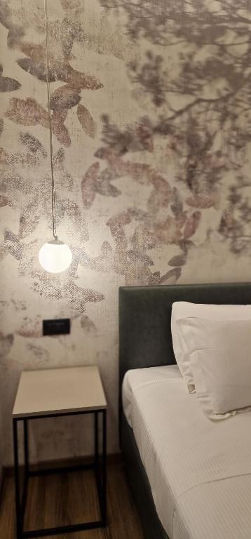 Postel nebo postele na pokoji v ubytování Hotel La Rocca