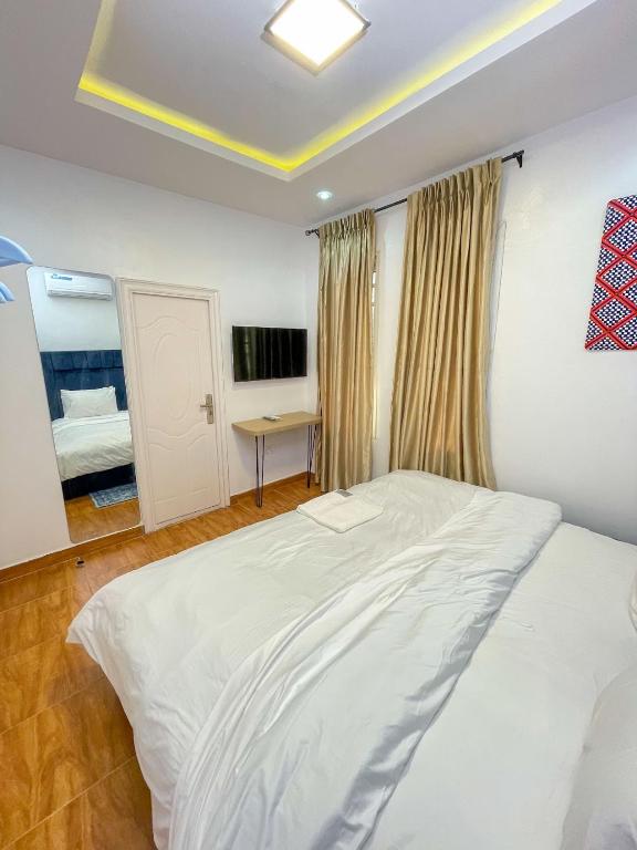 Postel nebo postele na pokoji v ubytování PENTAGON by Riz homes