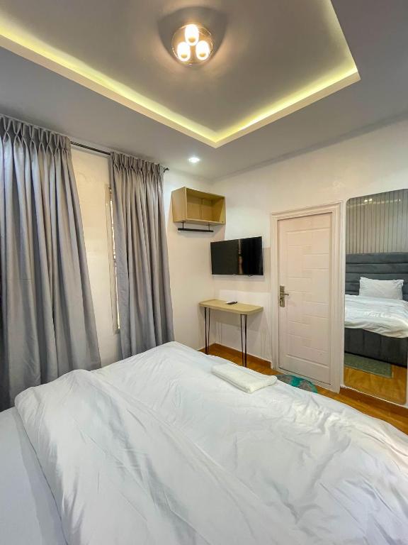 Postel nebo postele na pokoji v ubytování PENTAGON by Riz homes