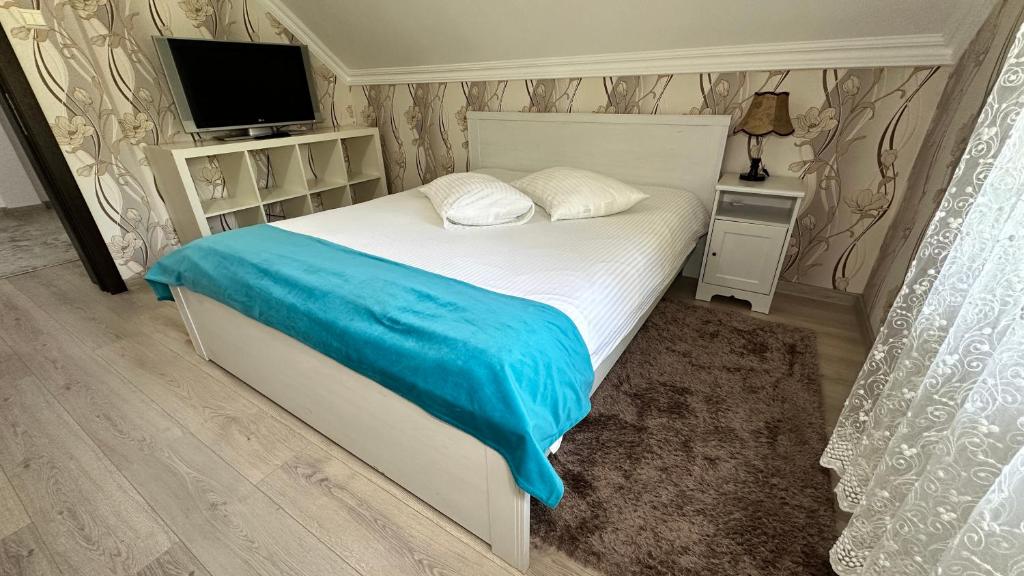 Postel nebo postele na pokoji v ubytování Hotel-Restaurant Milenium