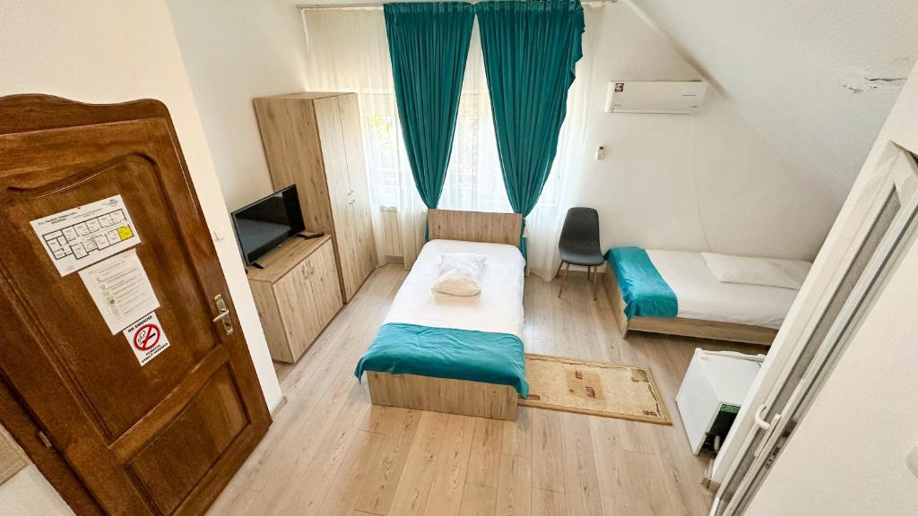 Postel nebo postele na pokoji v ubytování Hotel-Restaurant Milenium