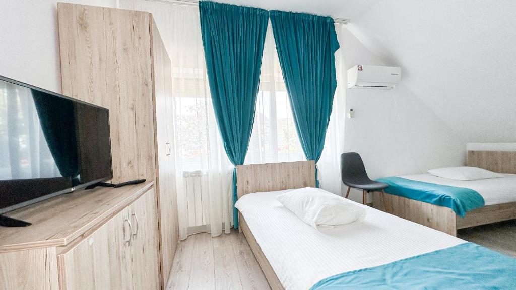 Postel nebo postele na pokoji v ubytování Hotel-Restaurant Milenium