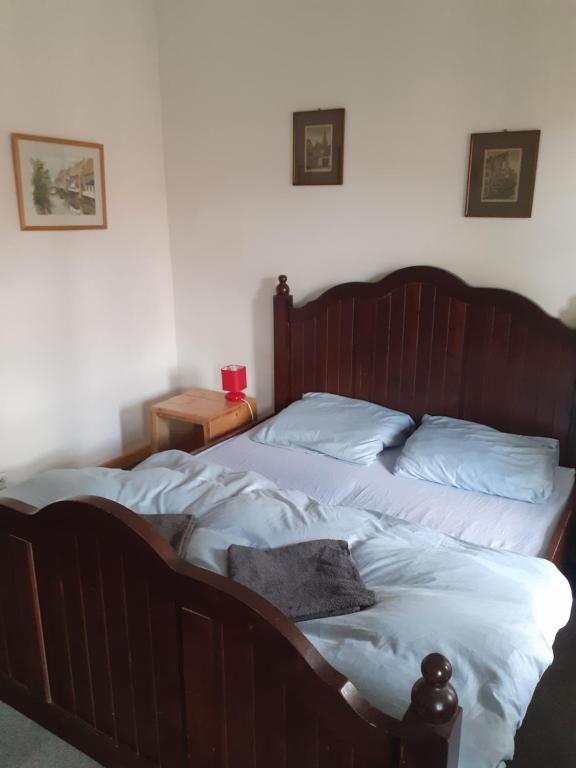 Postel nebo postele na pokoji v ubytování Kratochviluv mlyn