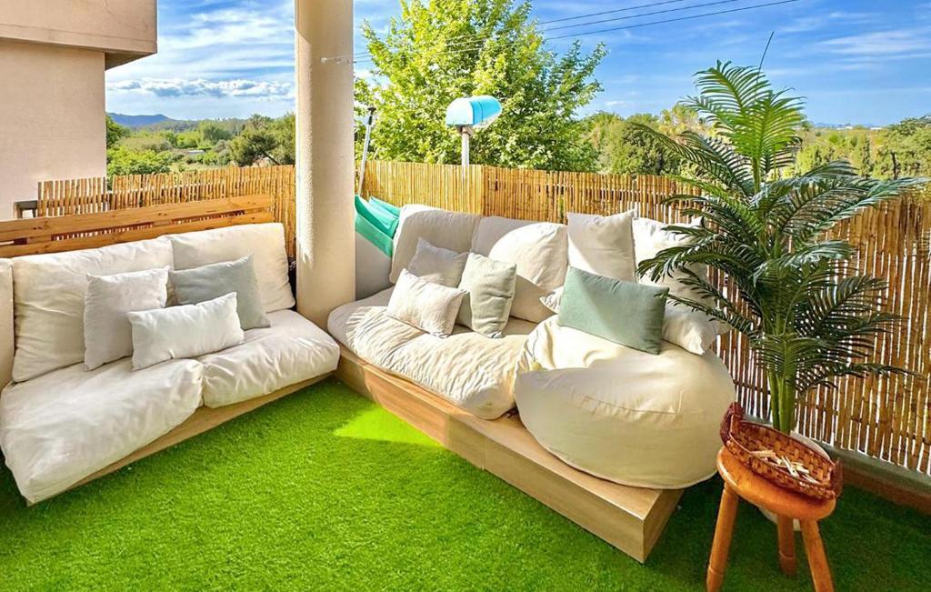 a living room with a white couch on a patio at 2 Bedroom Gorgeous Apartment In Sagunto in Sagunto