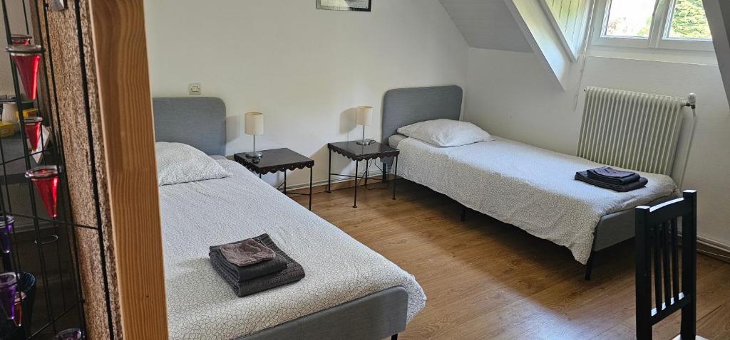Postel nebo postele na pokoji v ubytování Le Clos des Meix