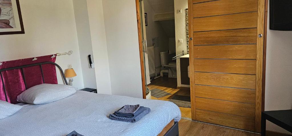 Postel nebo postele na pokoji v ubytování Le Clos des Meix