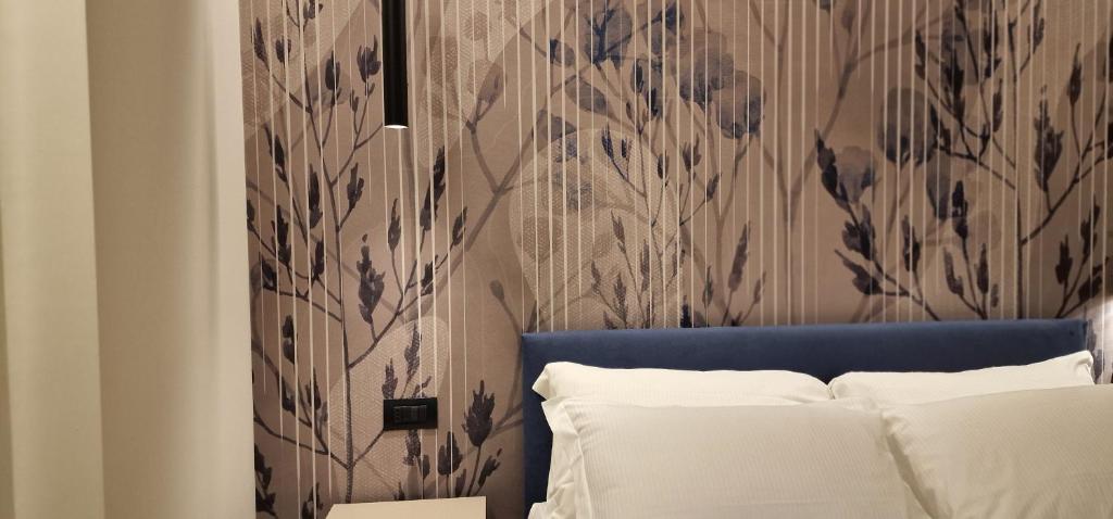 Postel nebo postele na pokoji v ubytování Hotel La Rocca