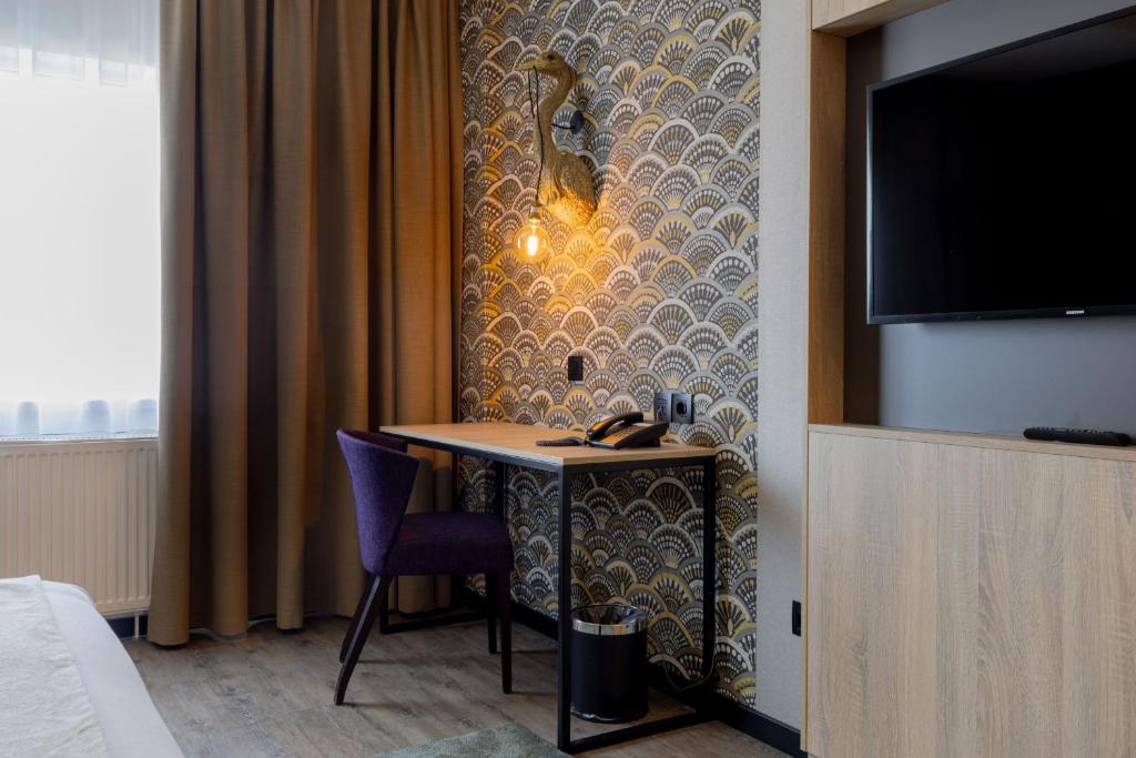 TV a/nebo společenská místnost v ubytování Shanghai Hotel Holland