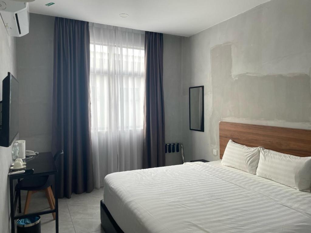 Postel nebo postele na pokoji v ubytování HPY Hotel
