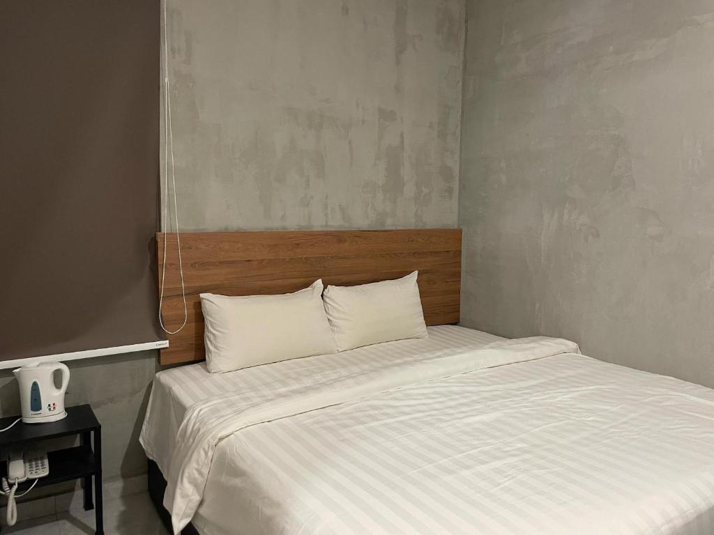 Postel nebo postele na pokoji v ubytování HPY Hotel