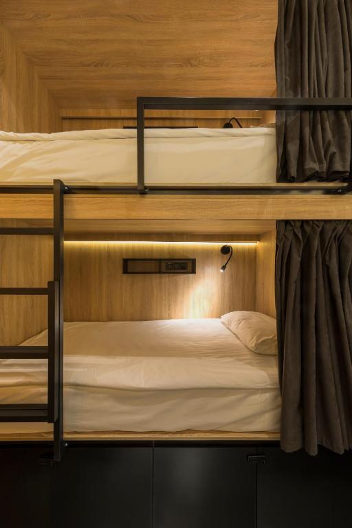Postel nebo postele na pokoji v ubytování Globe Runner Hotel & Hostel