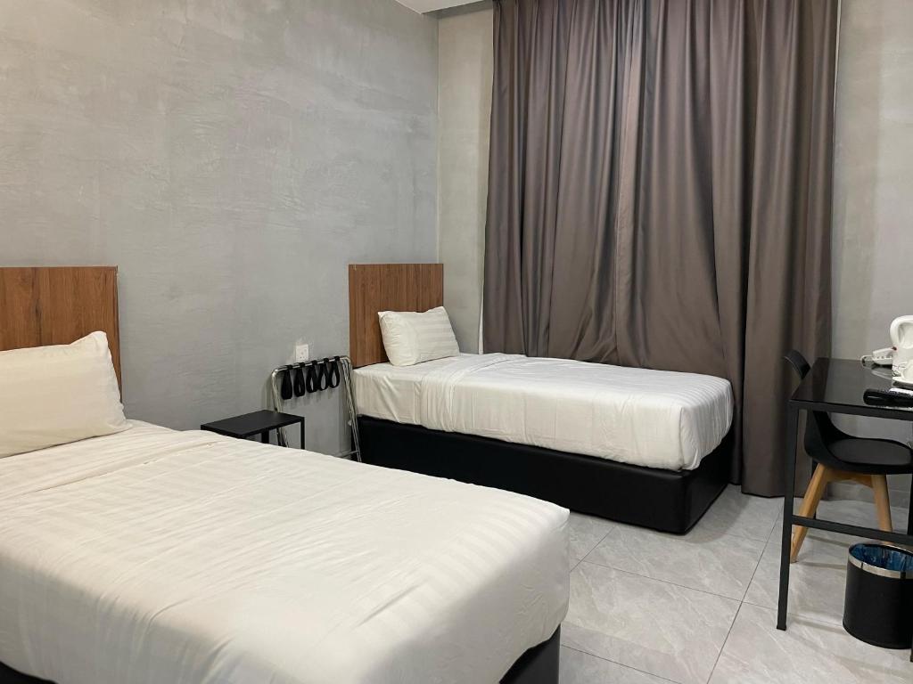 Postel nebo postele na pokoji v ubytování HPY Hotel