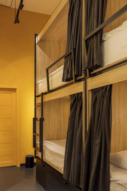 Postel nebo postele na pokoji v ubytování Globe Runner Hotel & Hostel