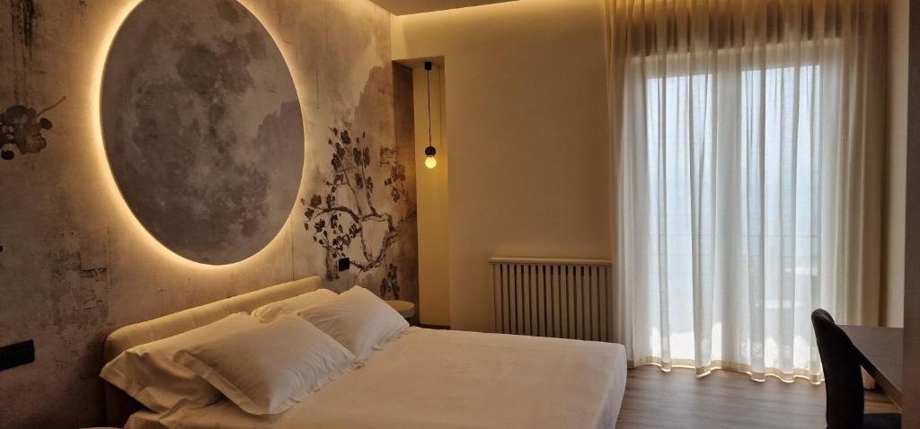 Postel nebo postele na pokoji v ubytování Hotel La Rocca