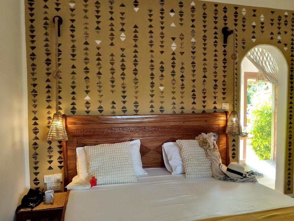 Postel nebo postele na pokoji v ubytování Juana Ocean Villas