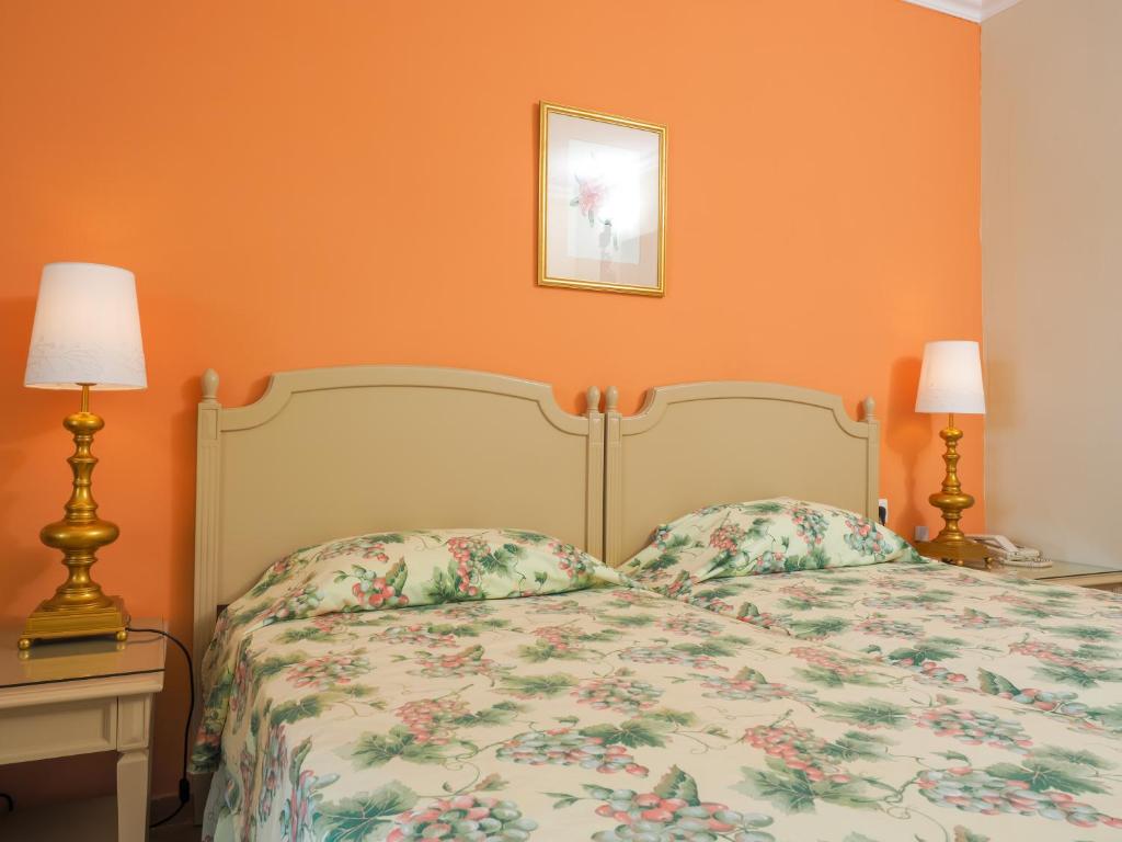 Postel nebo postele na pokoji v ubytování Paleo ArtNouveau Hotel - Adults Only