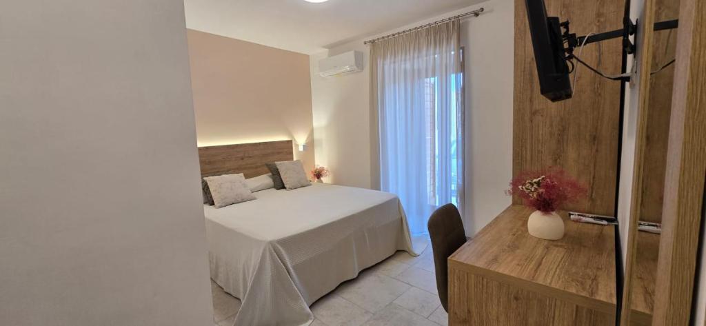 Postel nebo postele na pokoji v ubytování Hotel Punta San Francesco