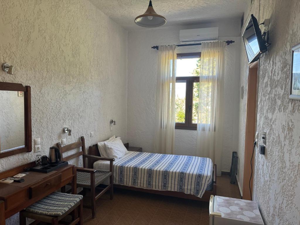Letto o letti in una camera di Pythaïs Hotel