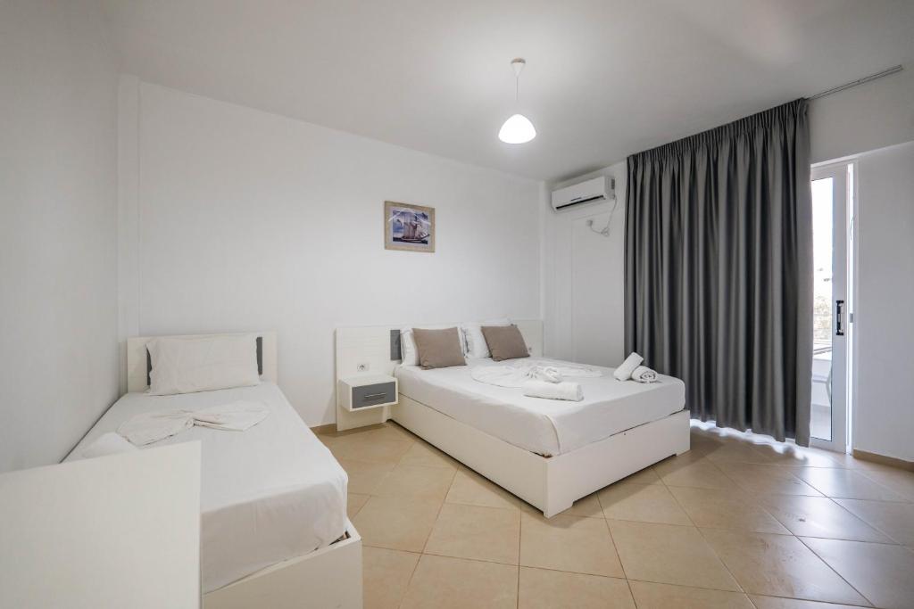 Cama o camas de una habitación en Sunshine Hotel
