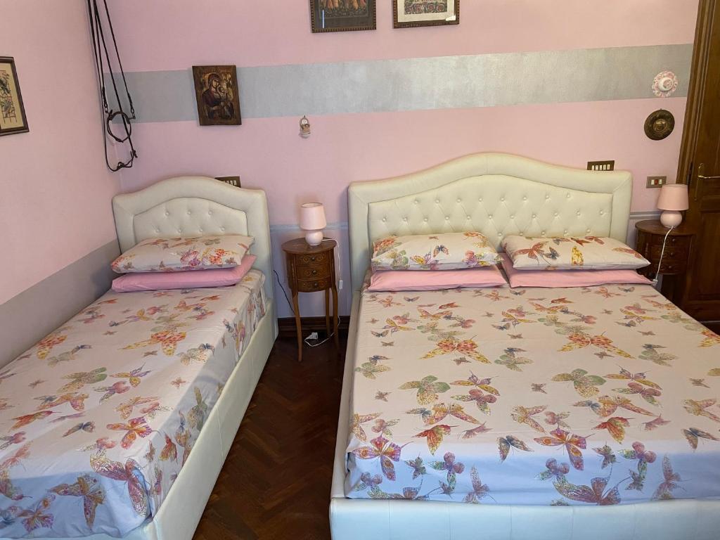 Postel nebo postele na pokoji v ubytování B&B Les Fleurettes