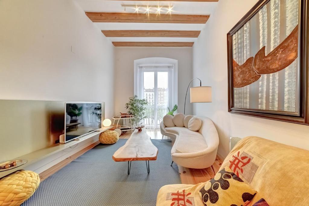 a living room with a couch and a table at Castillo 31 by Clabao in Pamplona