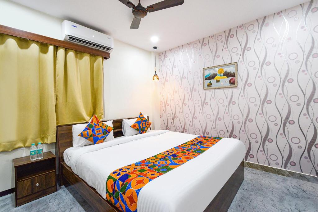 Ένα ή περισσότερα κρεβάτια σε δωμάτιο στο FabHotel Elite Inn