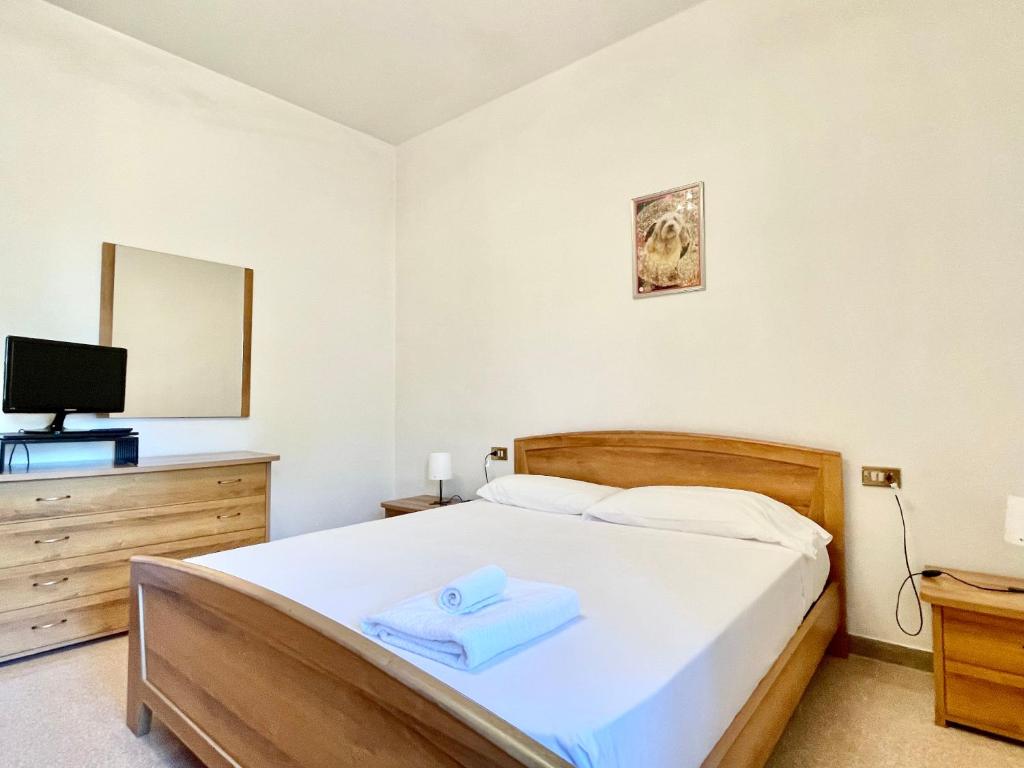 Postel nebo postele na pokoji v ubytování Spazioso e vicino al mare - Casa MareBlu