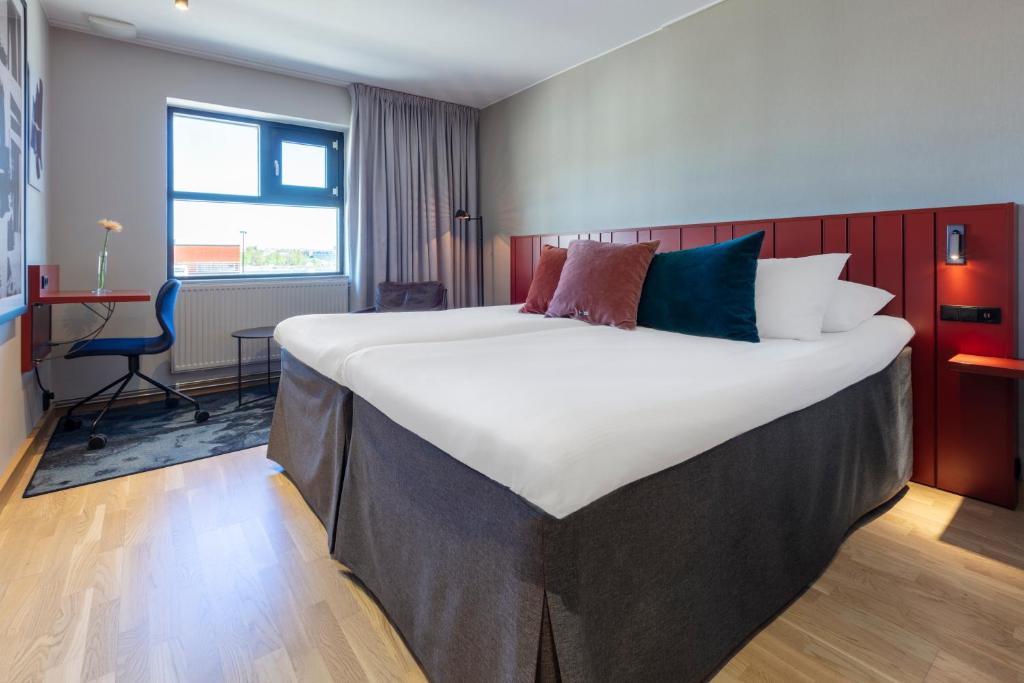 Postel nebo postele na pokoji v ubytování Home Hotel Carlscrona