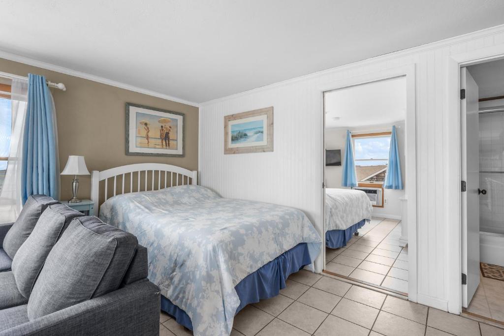 Voodi või voodid majutusasutuse Oceanside Condos toas
