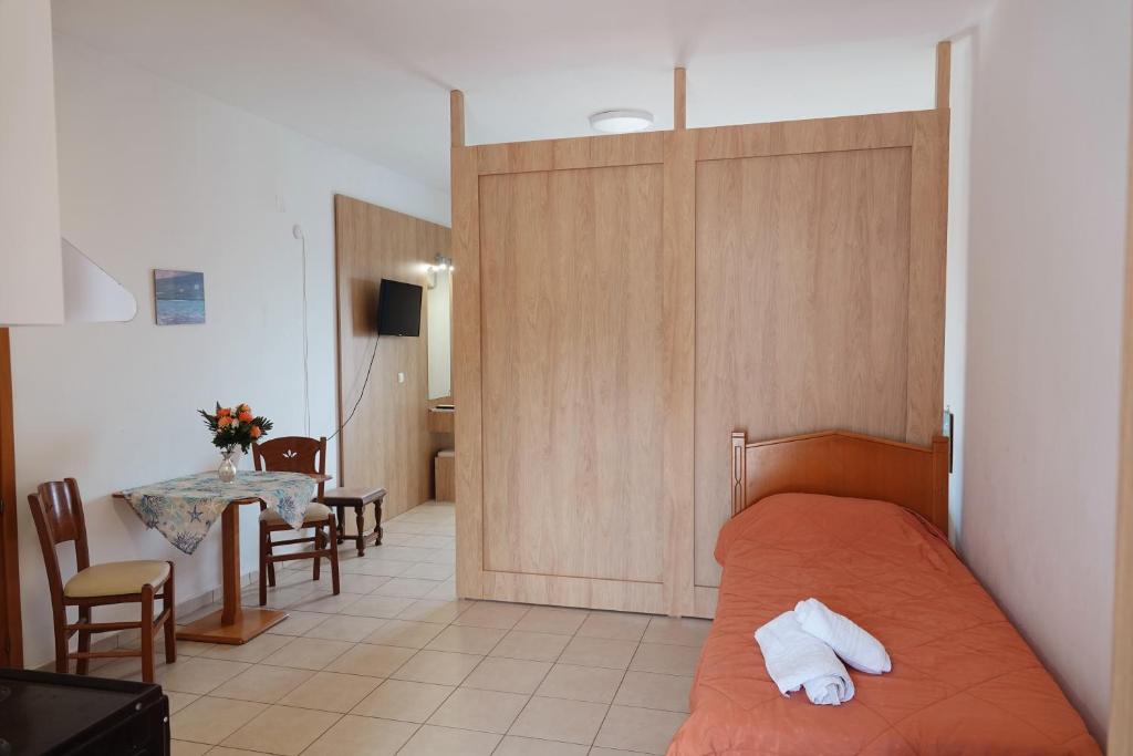 Postel nebo postele na pokoji v ubytování Aeriko Hotel Apartments