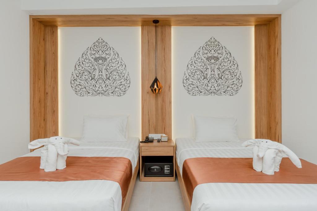 Postel nebo postele na pokoji v ubytování Botum Domrey Hotel
