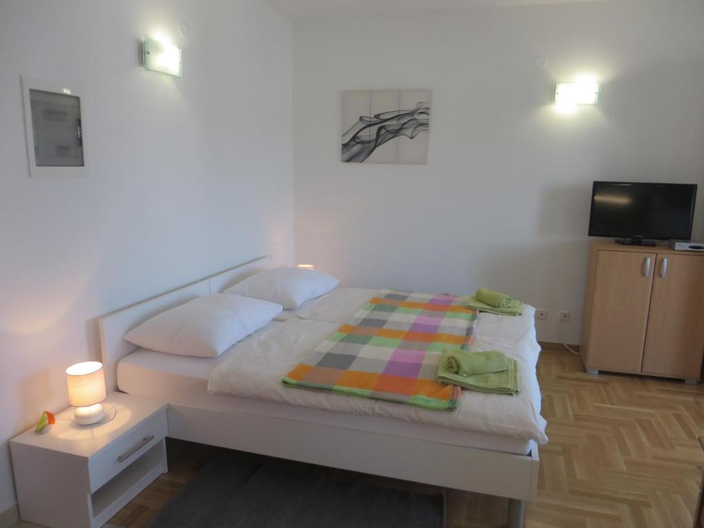 Posteľ alebo postele v izbe v ubytovaní Filipovic Apartments with Pool