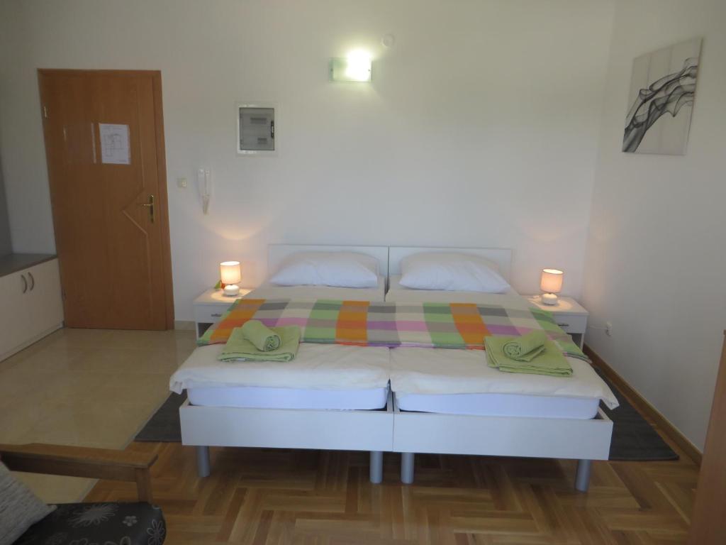 Posteľ alebo postele v izbe v ubytovaní Filipovic Apartments with Pool