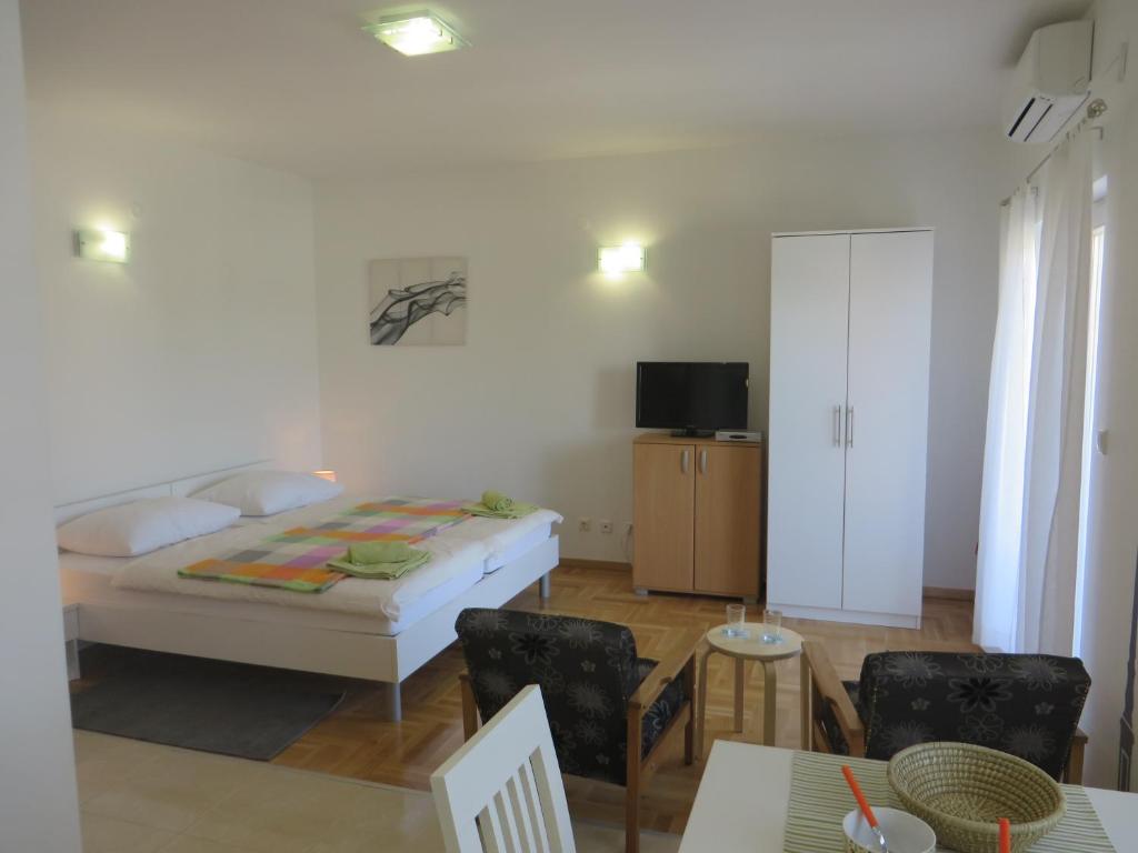 Posteľ alebo postele v izbe v ubytovaní Filipovic Apartments with Pool